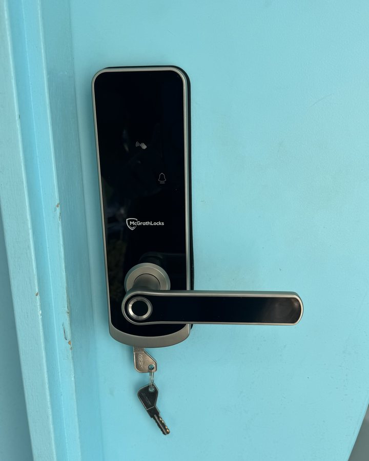 New fingerprint and keypad smart lock fitted to the same door, after